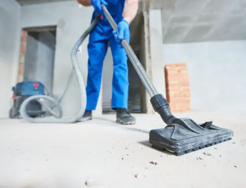 a person vacuuming the floor