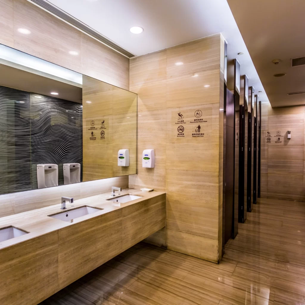 a bathroom with sinks and mirrors