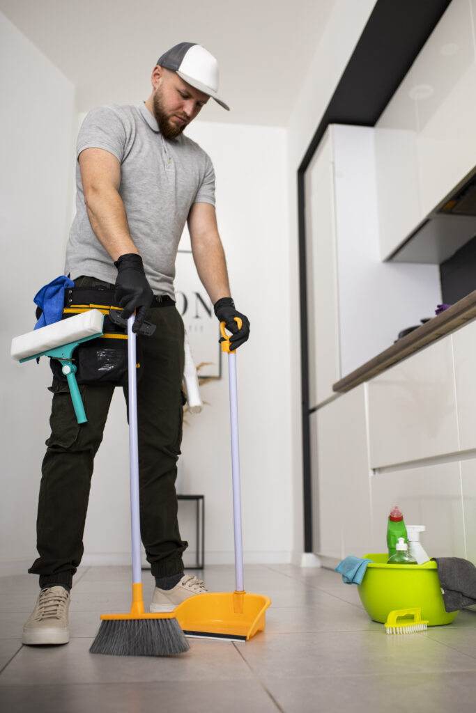 a person with a mop and bucket